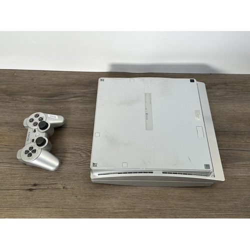 730 - A Sony PlayStation 3 CECH-3002B limited edition 320 GB silver console with DualShock 3 controller