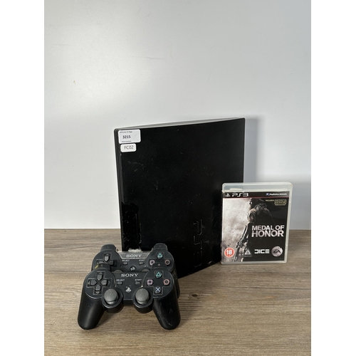 732 - A Sony PlayStation 3 CECH-3003A console with two controllers and Medal Of Honor game