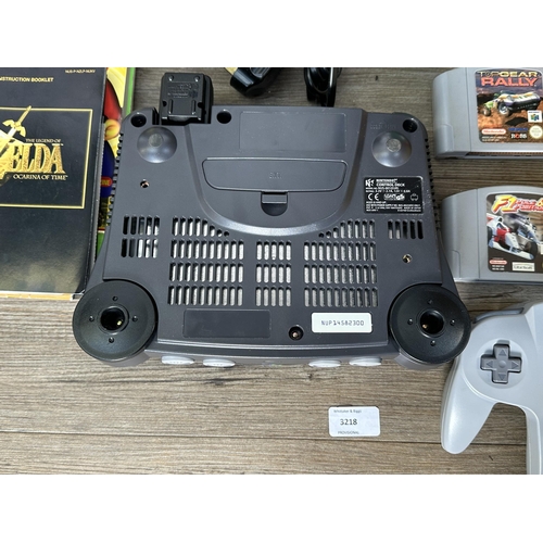 735 - A Nintendo N64 console with boxed controller, boxed Arcade Shark SV-364 fight stick, boxed racing wh... 