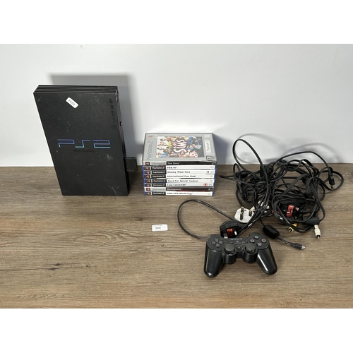 739 - A Sony PlayStation 2 console with games and accessories