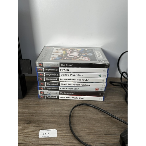 739 - A Sony PlayStation 2 console with games and accessories