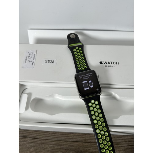 779 - A boxed Apple Watch series 2 stainless steel 42mm smart watch with six replacement straps