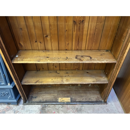 17 - A 19th century ecclesiastical pitch pine free standing bookcase - approx. 208cm high x 137cm wide x ... 