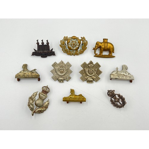 2036 - Ten military cap badges