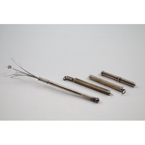 2264 - Four sterling silver items, three propelling toothpicks and one swizzle stick - approx. gross weight... 