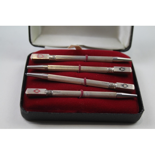 2271 - A boxed set of four stamped .925 sterling silver pencils with enamel card suit detail - approx. gros... 