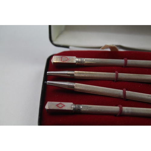 2271 - A boxed set of four stamped .925 sterling silver pencils with enamel card suit detail - approx. gros... 