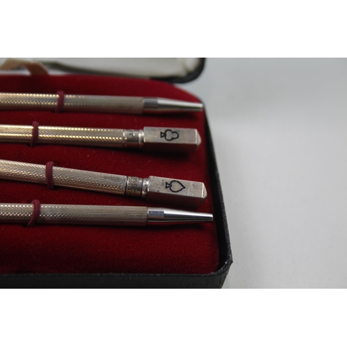 2271 - A boxed set of four stamped .925 sterling silver pencils with enamel card suit detail - approx. gros... 