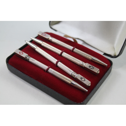 2271 - A boxed set of four stamped .925 sterling silver pencils with enamel card suit detail - approx. gros... 