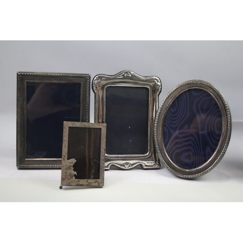 2280 - Four hallmarked sterling silver photograph frames - largest approx. 17cm x 12cm