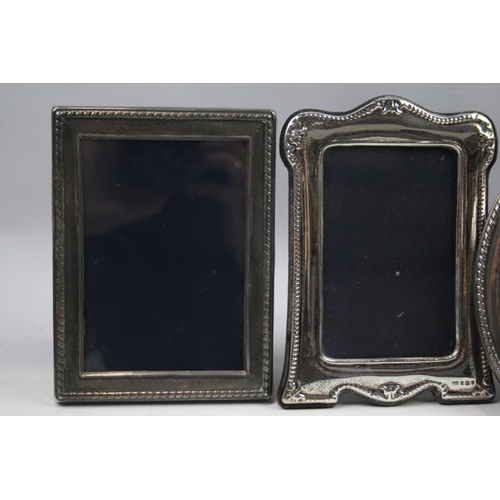 2280 - Four hallmarked sterling silver photograph frames - largest approx. 17cm x 12cm