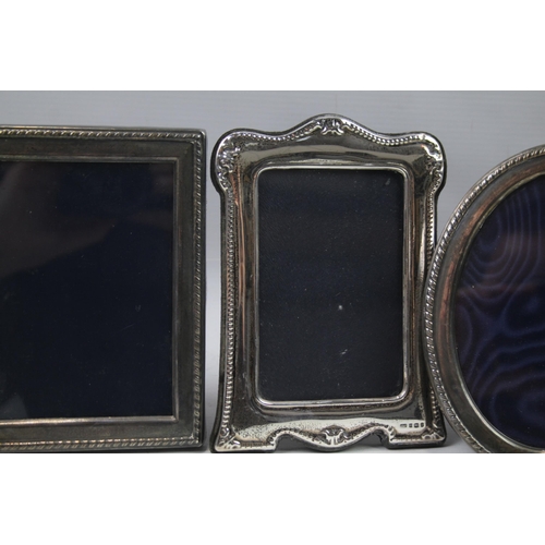 2280 - Four hallmarked sterling silver photograph frames - largest approx. 17cm x 12cm