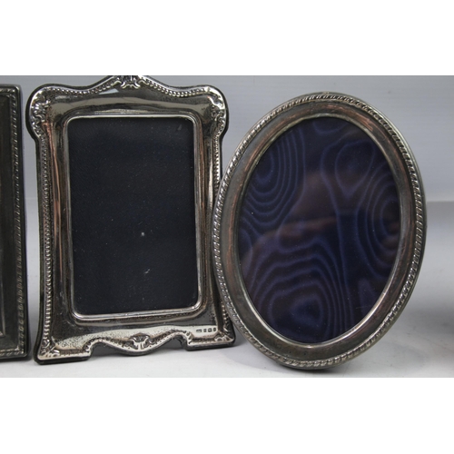 2280 - Four hallmarked sterling silver photograph frames - largest approx. 17cm x 12cm