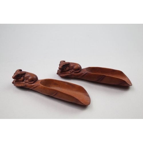 2353 - Two Oriental carved wooden zodiac snake tea/coffee scoops