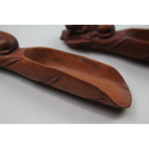 2353 - Two Oriental carved wooden zodiac snake tea/coffee scoops