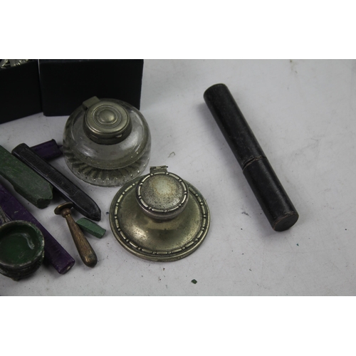 565 - A collection of items to include ink wells, wax seals etc.