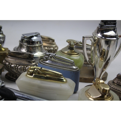 571 - A large collection of table lighters