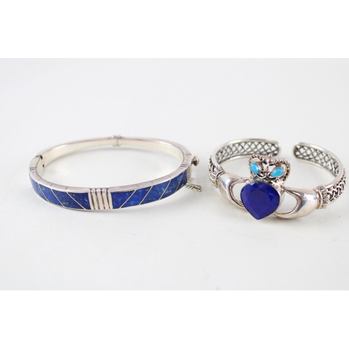 2294 - Two silver lapis lazuli bangles - approx. gross weight 44g