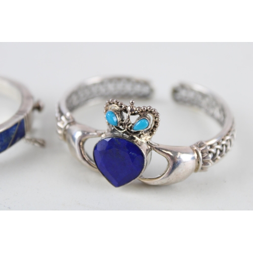 2294 - Two silver lapis lazuli bangles - approx. gross weight 44g