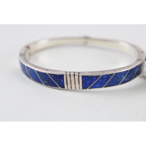 2294 - Two silver lapis lazuli bangles - approx. gross weight 44g