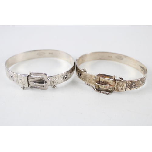 2304 - Two Excalibur silver buckle design bangles - approx. gross weight 40g