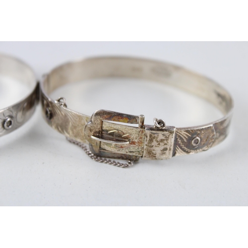 2304 - Two Excalibur silver buckle design bangles - approx. gross weight 40g