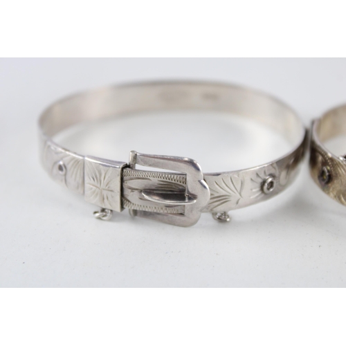 2304 - Two Excalibur silver buckle design bangles - approx. gross weight 40g