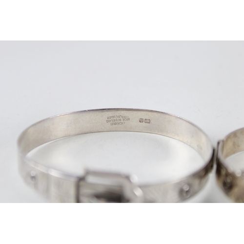 2304 - Two Excalibur silver buckle design bangles - approx. gross weight 40g