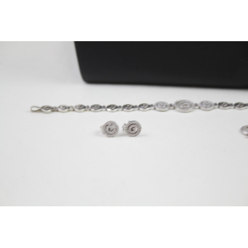 2318 - A .925 silver necklace, bracelet, pendant and earrings set - approx. gross weight 33g