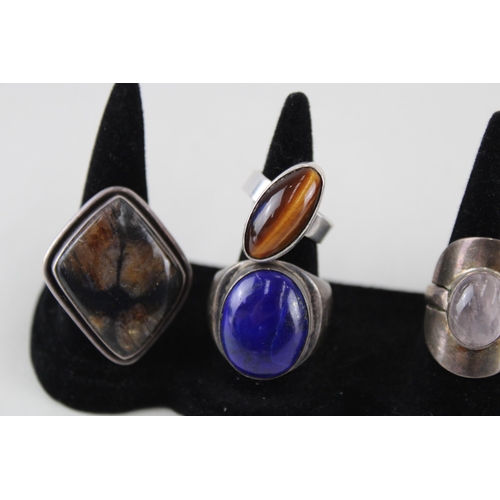 2328 - A collection of silver gemstone set cocktail rings - approx. gross weight 66g