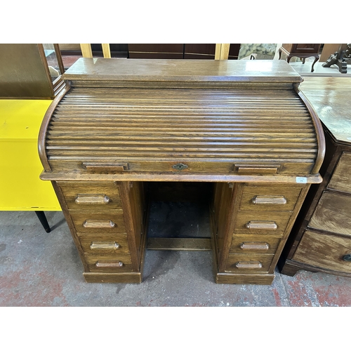 156 - An early 20th century Lebus oak roll top desk - approx. 102cm high x 107cm wide x 69cm deep