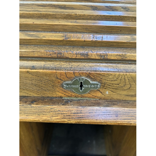 156 - An early 20th century Lebus oak roll top desk - approx. 102cm high x 107cm wide x 69cm deep