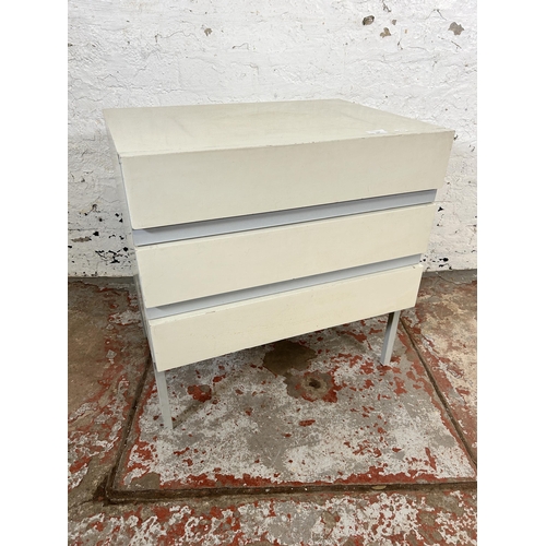 167 - A mid 20th century white painted bedside chest of drawers