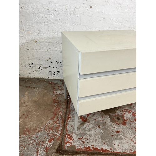 167 - A mid 20th century white painted bedside chest of drawers