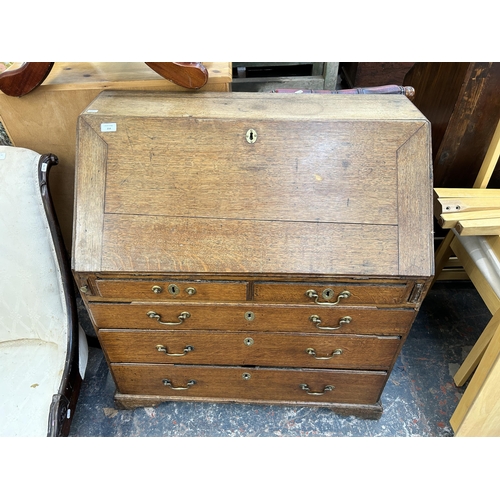 218 - A George III oak bureau