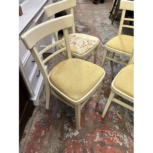 219 - A set of four mid 20th century white painted dining chairs