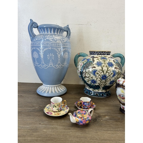 360 - Eleven pieces of Past Times ceramics to include jar and cover, twin handled vase etc. - largest appr... 