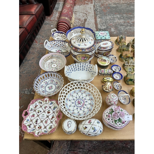 364 - A collection of ceramic trinket boxes and lacework baskets to include Past Times, Crown Porcelain et... 