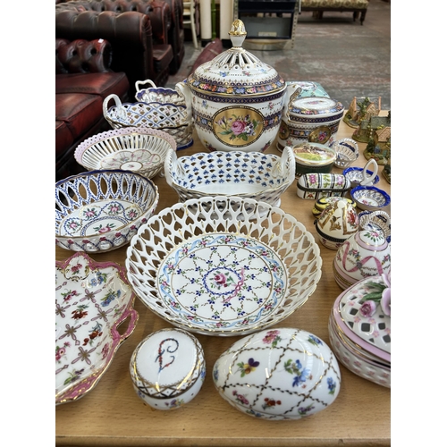 364 - A collection of ceramic trinket boxes and lacework baskets to include Past Times, Crown Porcelain et... 