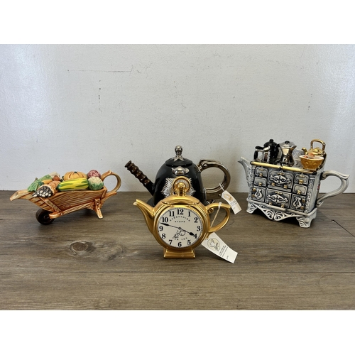 371 - Four the Teapottery ceramic novelty teapots to include limited edition 1503/3000 French stove etc.