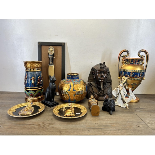 373 - A collection of Egyptian items to include Danbury Mint Cleopatra figurine, two Franklin Mint Heirloo... 