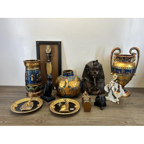 373 - A collection of Egyptian items to include Danbury Mint Cleopatra figurine, two Franklin Mint Heirloo... 