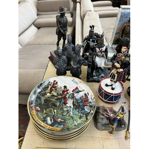 377 - A collection of military themed ceramics and collectables to include Franklin Mint Samurai hand pain... 