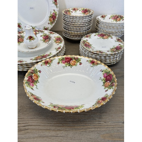 385 - A collection of Royal Albert Old Country Roses china to include fifteen saucers, six dinner plates e... 