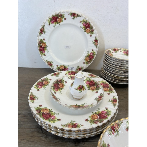 385 - A collection of Royal Albert Old Country Roses china to include fifteen saucers, six dinner plates e... 