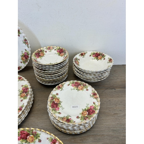 385 - A collection of Royal Albert Old Country Roses china to include fifteen saucers, six dinner plates e... 