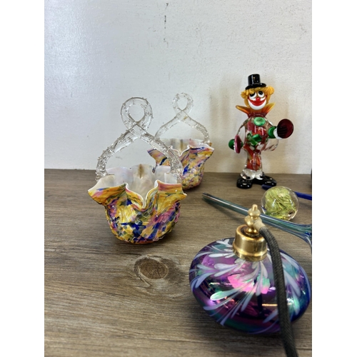 387 - A collection of art glassware to include Murano clown, atomiser, Isle Of Wight paperweight etc.