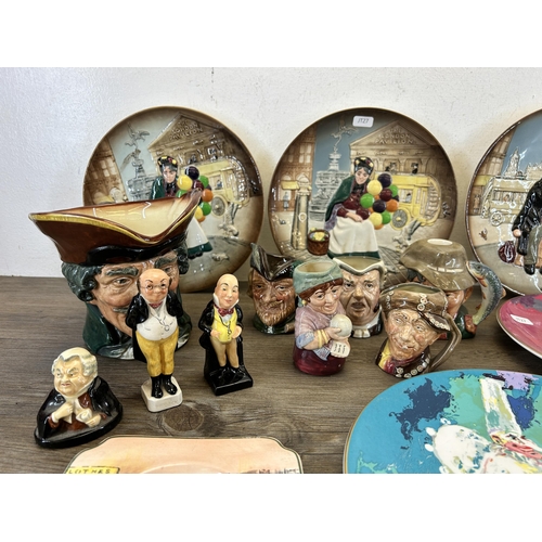 390 - A collection of Royal Doulton china to include six character jugs, two The Old Balloon Seller collec... 