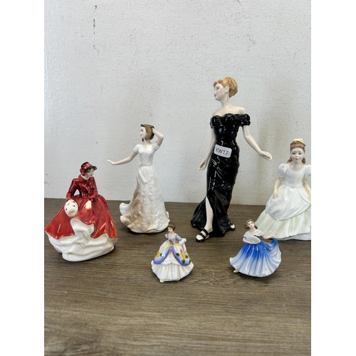 393 - Nine Royal Doulton figurines to include Emma HN3208, Buddies HN3396, Christmas Day HN3488, Classics ... 