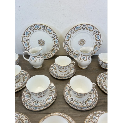 404 - A collection of Royal Grafton Regency bone china to include twelve teacups, twelve saucers, twelve s... 